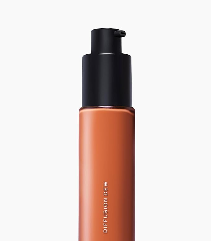 MAKE Beauty Diffusion Dew Skin Tint. Sheer to Medium Coverage Radiant Finish. Blurring, Smoothing, and Brightening for Glowing Complexion. Enhanced with Niacinamide and Adenosine. Bronze 14