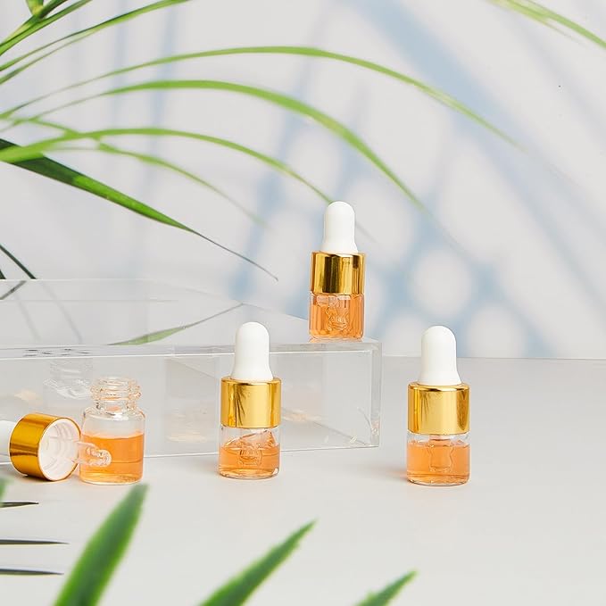 200 Pcs Mini Glass Oil Dropper Bottle Bulk, Clear Essential Small Empty Bottles Sample Containers Perfume Liquid Vials with Cap for Traveling (1 ml,Gold)