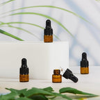 200 Pcs Mini Glass Oil Dropper Bottle Bulk, Clear Essential Small Empty Bottles Sample Containers Perfume Liquid Vials with Cap for Traveling (1 ml,Amber)