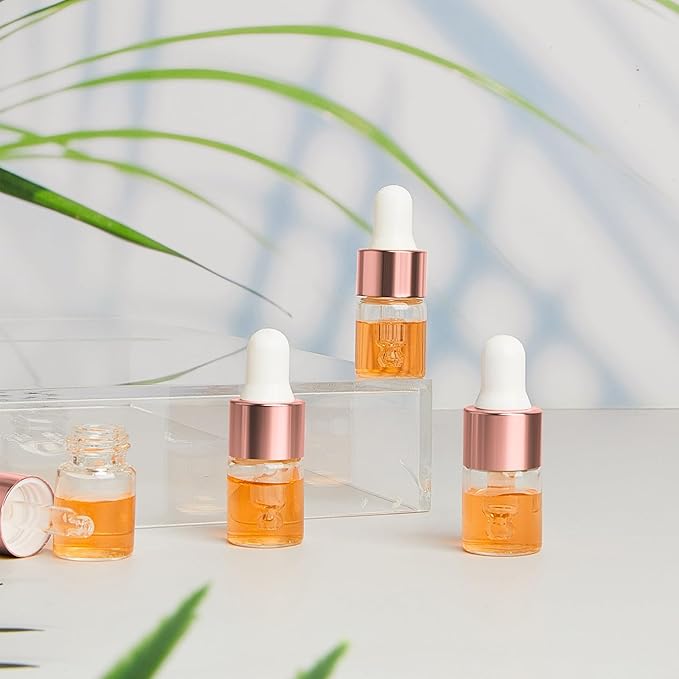 200 Pcs Mini Glass Oil Dropper Bottle Bulk, Clear Essential Small Empty Bottles Sample Containers Perfume Liquid Vials with Cap for Traveling (2 ml,Rose Gold)