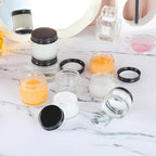 24 Pack 2oz Clear Glass Jars Small Glass Containers with Black Metal Lids Empty Cosmetic Jars with Inner Liners and Lids Clear Glass Lotion Jars with Labels for Traveling