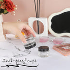 24 Pack 1oz Clear Glass Jars Small Glass Containers with Black Metal Lids Empty Cosmetic Jars with Inner Liners and Lids Clear Glass Lotion Jars with Labels for Traveling