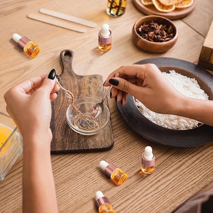 200 Pcs Mini Glass Oil Dropper Bottle Bulk, Clear Essential Small Empty Bottles Sample Containers Perfume Liquid Vials with Cap for Traveling (1 ml,Rose Gold)